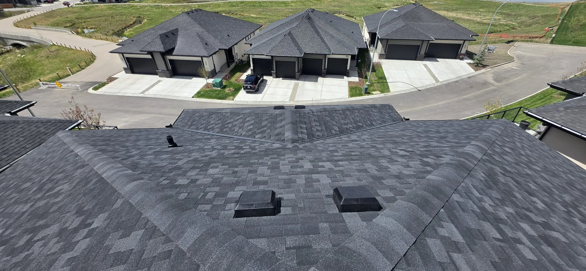 Black shingle hip roof completed in Calgary