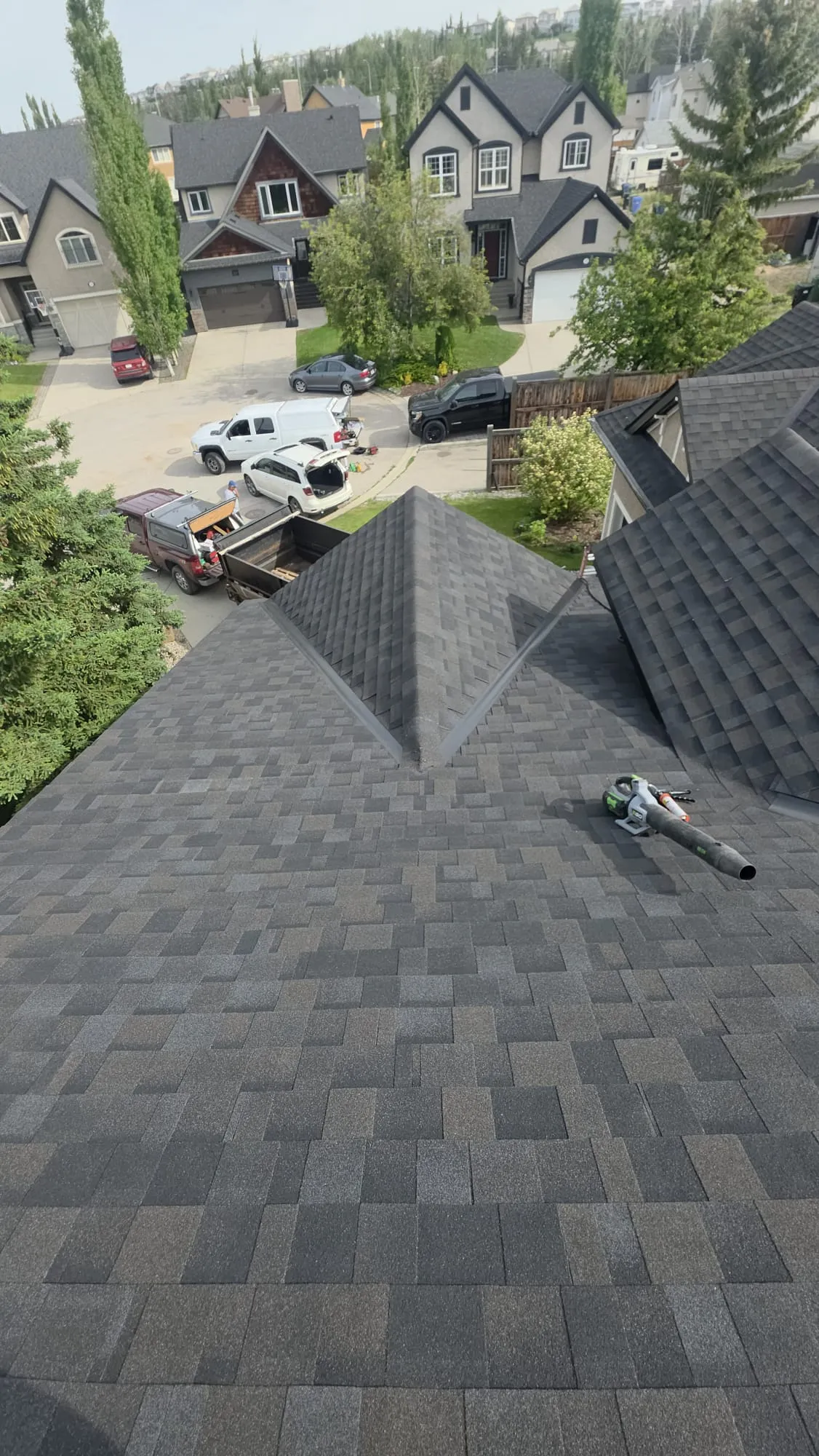 Charcoal shingle hip roof aerial in Calgary