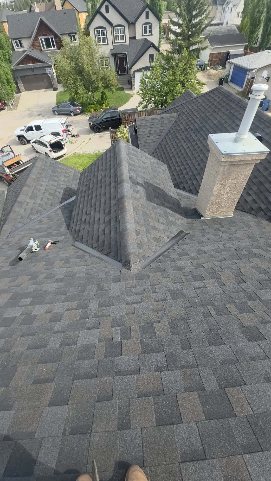Charcoal shingle roof hip valley in Calgary