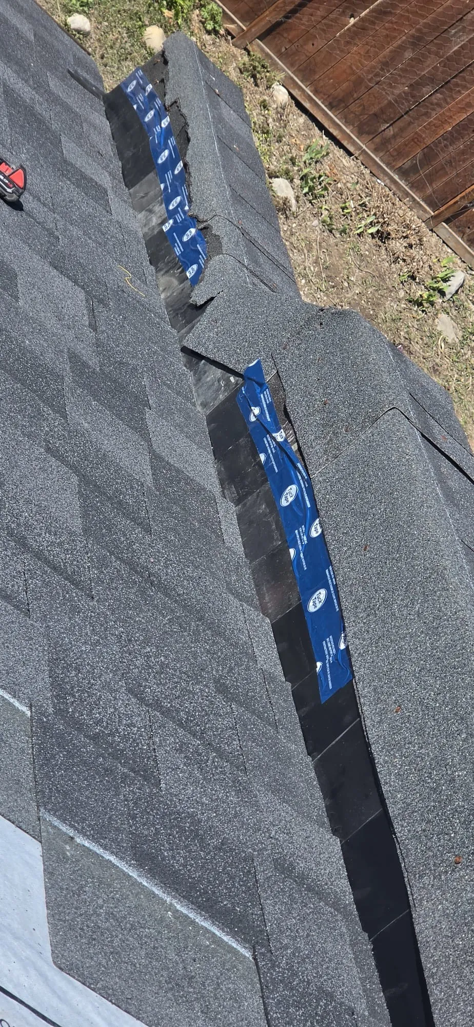 Cracked ridge shingle inspection tuck tape seam